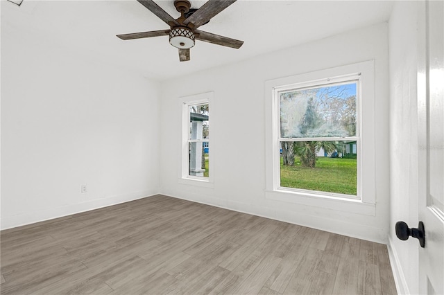 unfurnished room with light hardwood / wood-style flooring and ceiling fan