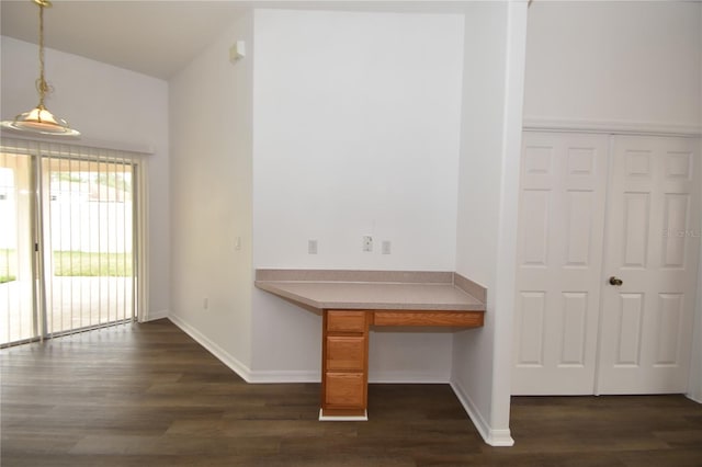 interior space featuring dark wood-style floors and baseboards