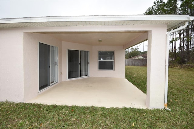 view of patio featuring fence