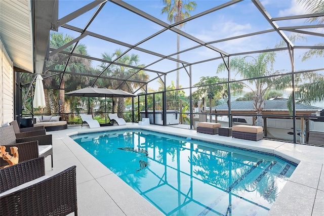 outdoor pool featuring a patio, outdoor lounge area, a lanai, and a hot tub