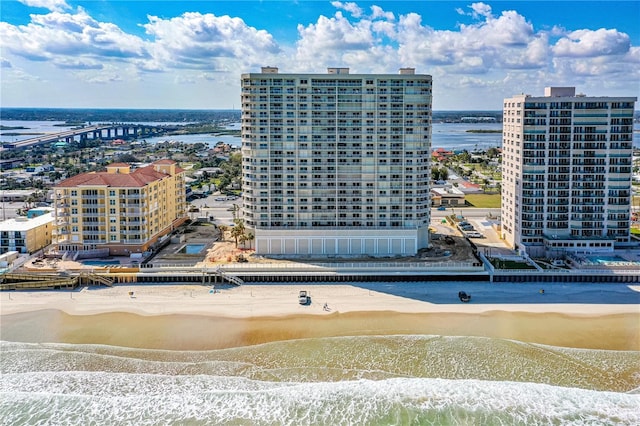 bird's eye view with a water view and a view of the beach