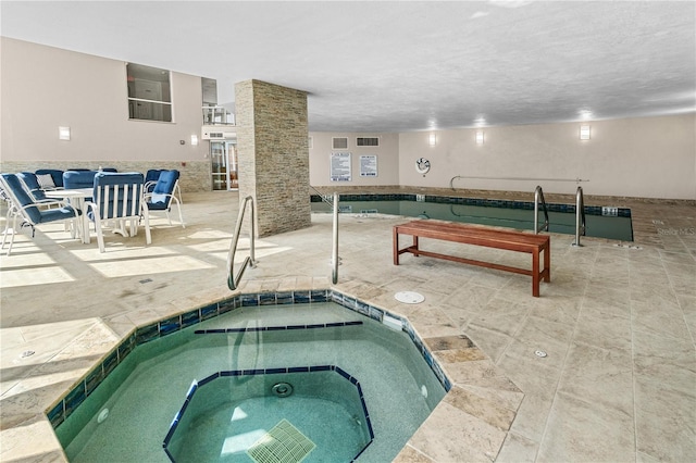 view of swimming pool featuring an indoor in ground hot tub