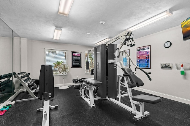 workout area with a textured ceiling