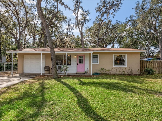 ranch-style house with a garage and a front yard