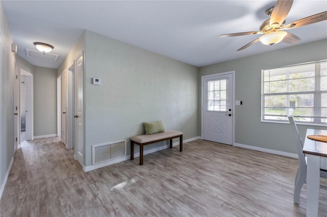 entryway with ceiling fan and light wood-type flooring