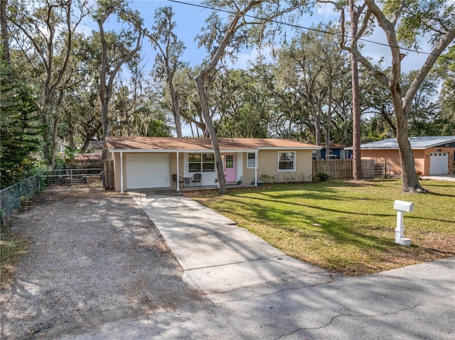 single story home with a garage and a front yard