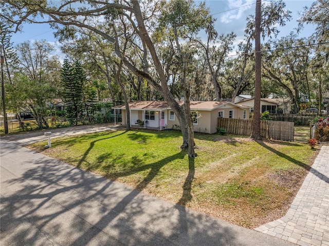 single story home with a front yard