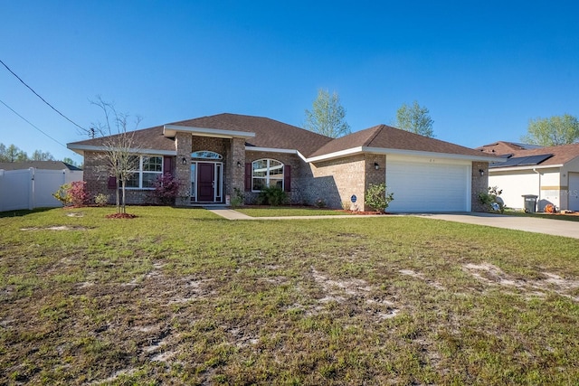 view of front of home with an attached garage, brick siding, fence, driveway, and a front lawn