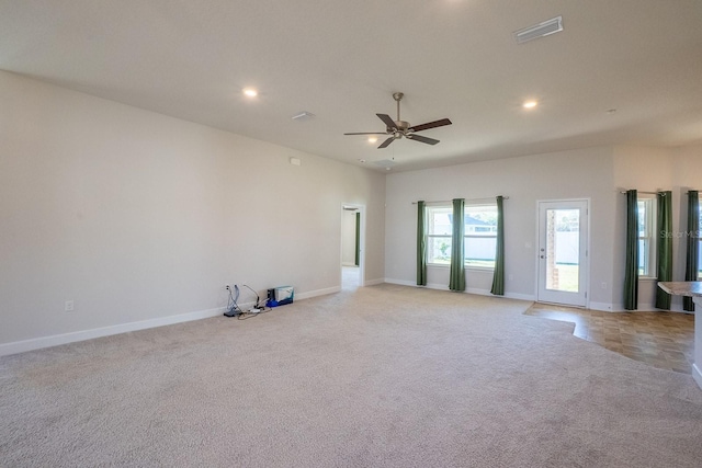 empty room with recessed lighting, visible vents, light carpet, ceiling fan, and baseboards