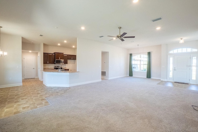 unfurnished living room featuring light carpet, baseboards, visible vents, and recessed lighting