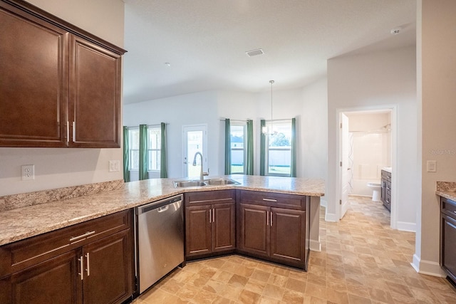 kitchen featuring a sink, a peninsula, dark brown cabinets, and dishwasher