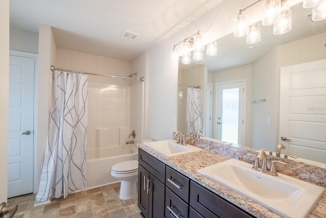 full bath with double vanity, shower / tub combo, visible vents, and a sink