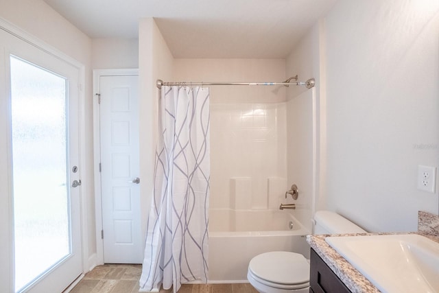 full bathroom with shower / bath combination with curtain, a wealth of natural light, vanity, and toilet