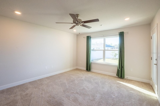 carpeted empty room with recessed lighting, ceiling fan, and baseboards