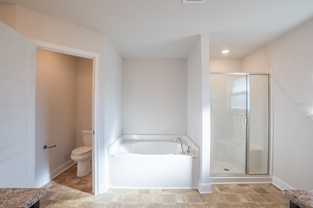 bathroom featuring baseboards, visible vents, toilet, a shower stall, and a bath