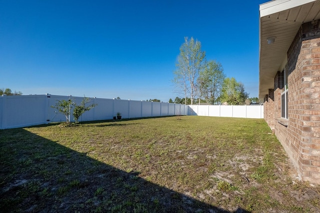 view of yard featuring a fenced backyard