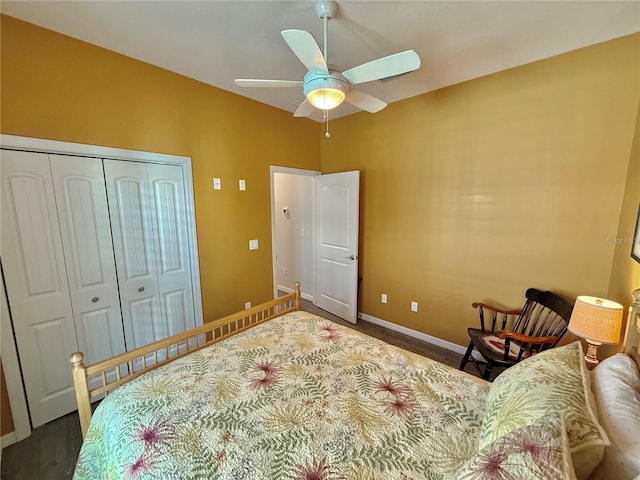 bedroom with a closet, ceiling fan, and baseboards