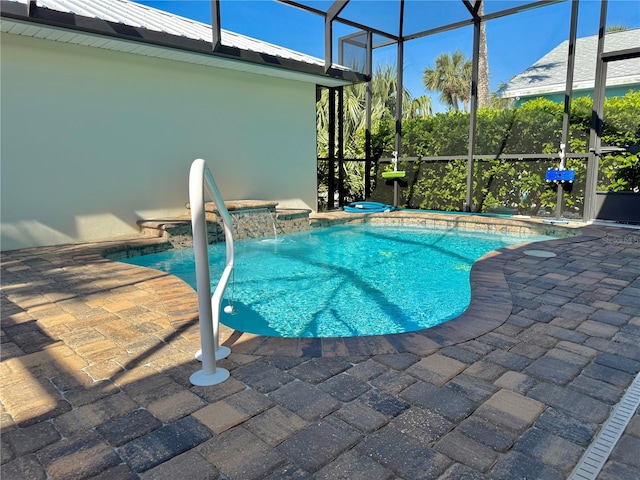 pool with a patio, an in ground hot tub, and a lanai