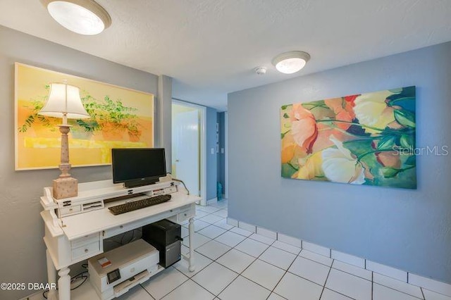 tiled home office featuring a textured ceiling