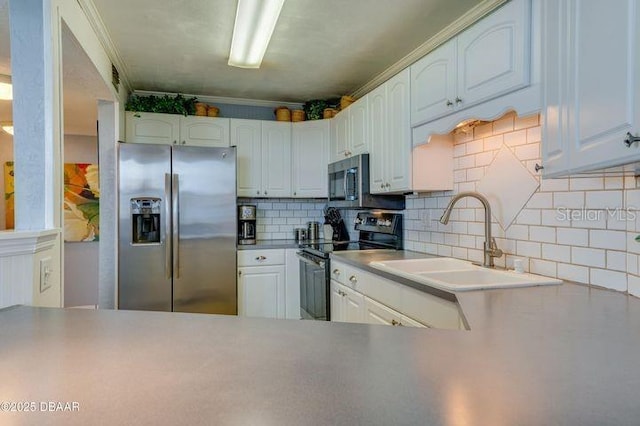 kitchen with white cabinetry, stainless steel appliances, sink, and backsplash