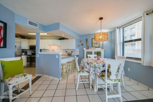 dining room with light tile patterned floors