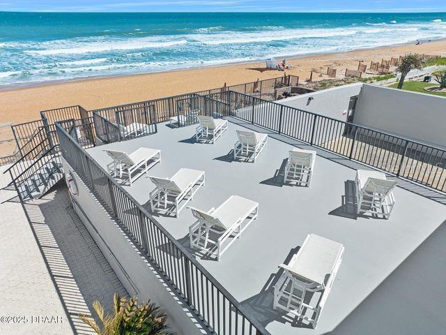 aerial view with a view of the beach and a water view