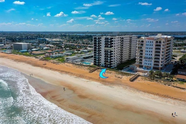 birds eye view of property featuring a view of the beach and a water view