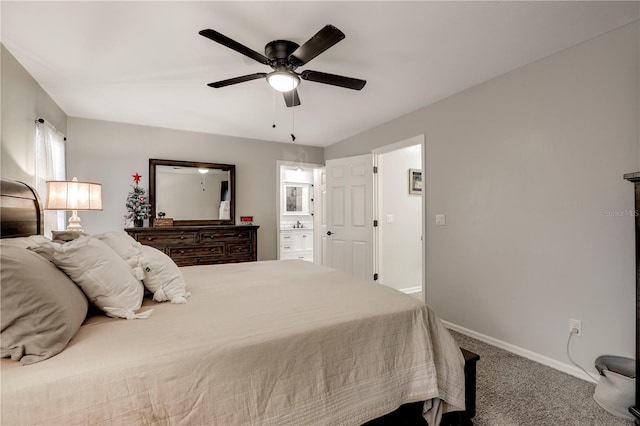 bedroom featuring ceiling fan, ensuite bathroom, carpet flooring, and baseboards