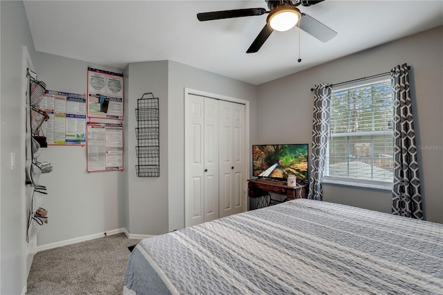 bedroom with ceiling fan, a closet, carpet, and baseboards