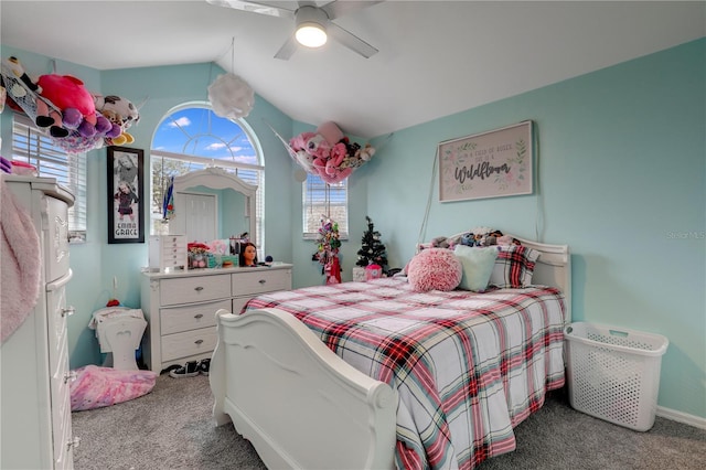 bedroom featuring lofted ceiling, carpet, and a ceiling fan