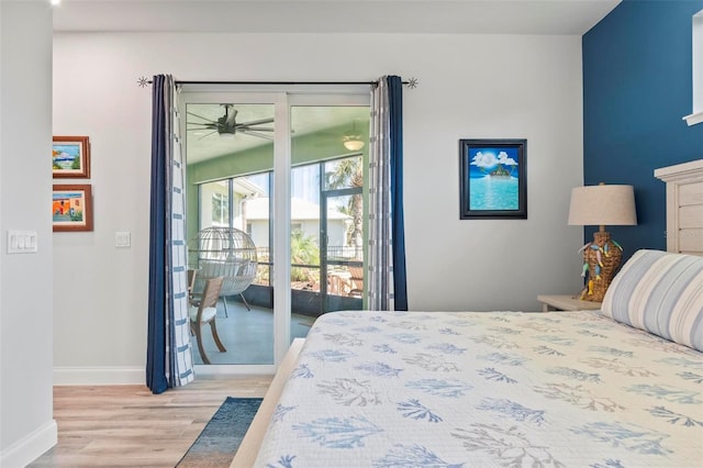 bedroom with baseboards, light wood-style flooring, and access to exterior