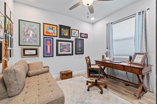 home office with baseboards, recessed lighting, a ceiling fan, and light wood-style floors