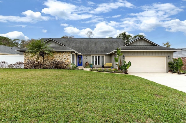 single story home with a front yard and a garage