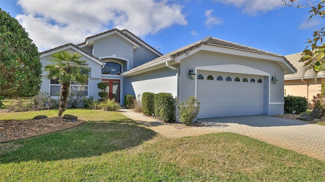 ranch-style home with a garage and a front lawn