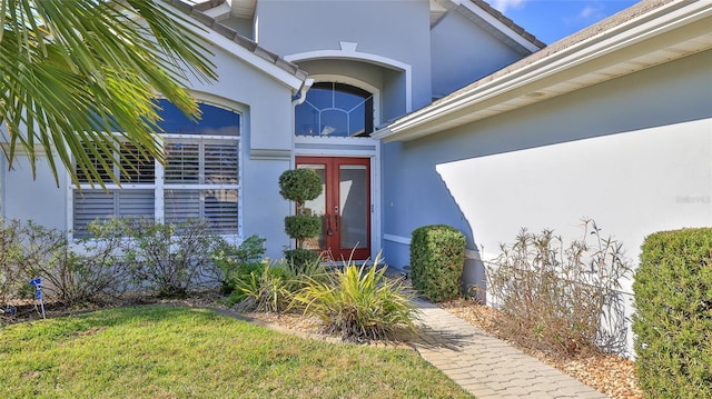 property entrance with a yard