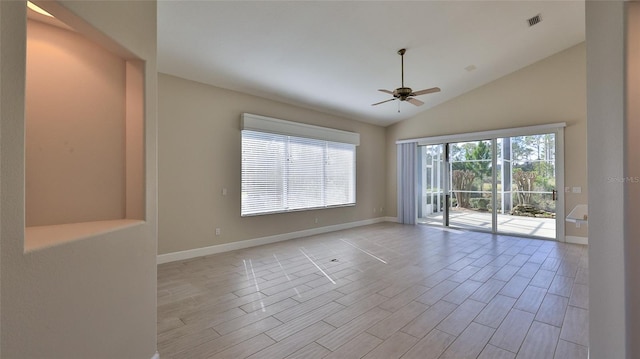 spare room with ceiling fan, light hardwood / wood-style flooring, and lofted ceiling