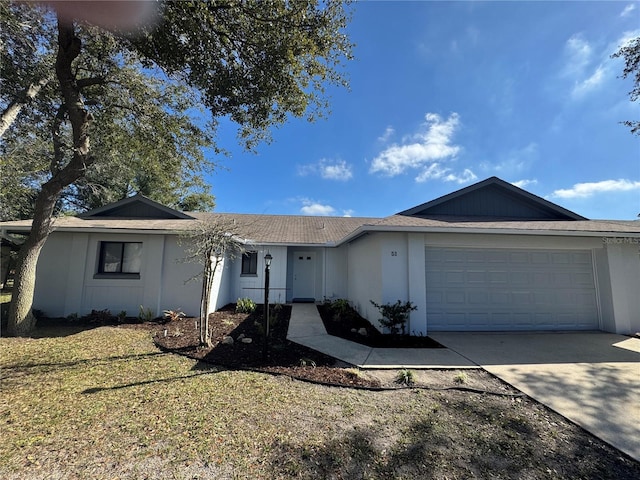 ranch-style house with a garage and a front yard