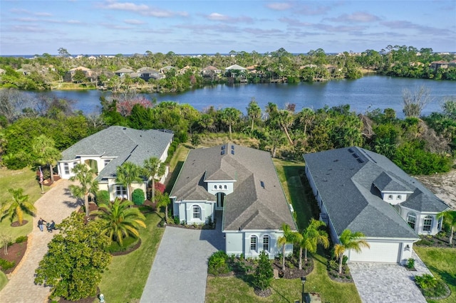 birds eye view of property featuring a residential view and a water view