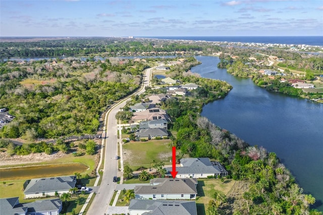 bird's eye view featuring a residential view and a water view