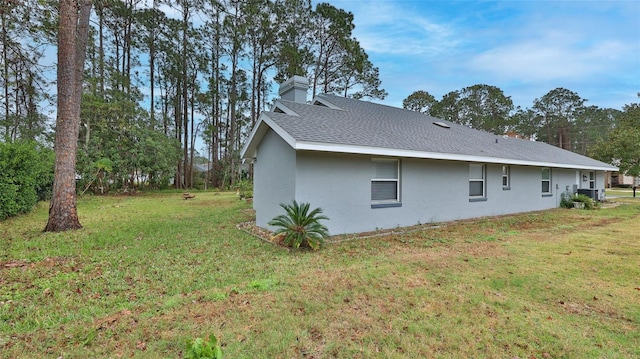 view of side of home featuring a yard