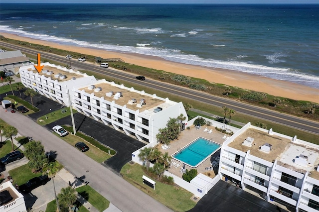 bird's eye view with a water view and a view of the beach