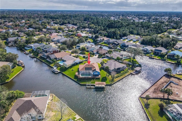 drone / aerial view with a residential view and a water view