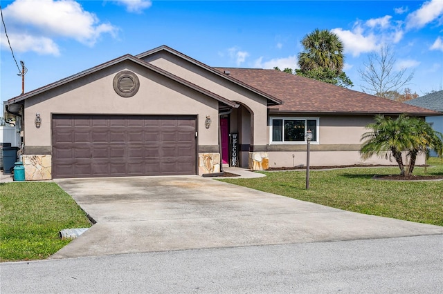 ranch-style home featuring stucco siding, a shingled roof, a garage, driveway, and a front lawn