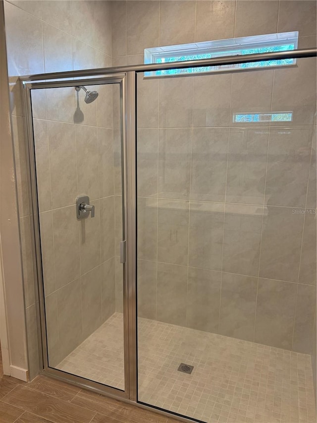 8 Burnham Ln, Palm Coast, FL 32137 - bathroom featuring a stall shower and wood finished floors