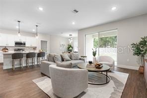 8 Burnham Ln, Palm Coast, FL 32137 - living room featuring recessed lighting and dark wood finished floors
