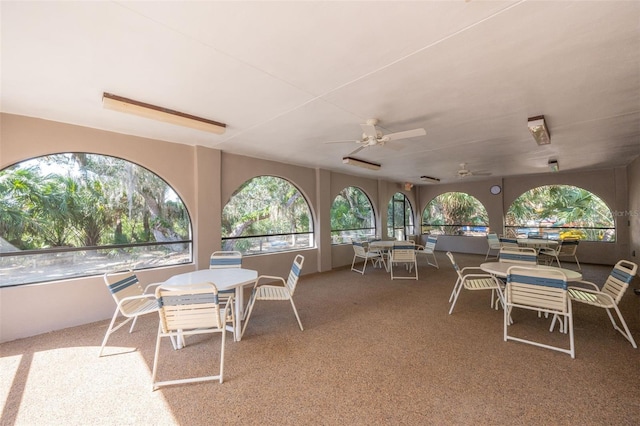 view of patio / terrace featuring a ceiling fan and outdoor dining space