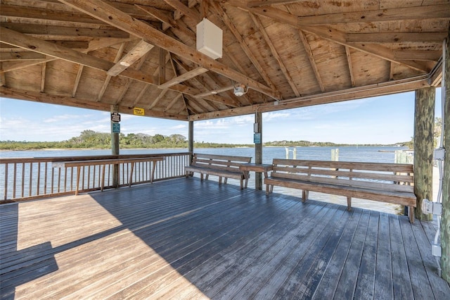 view of dock with a gazebo and a deck with water view