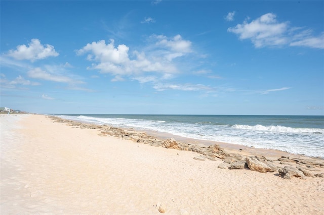 property view of water featuring a beach view