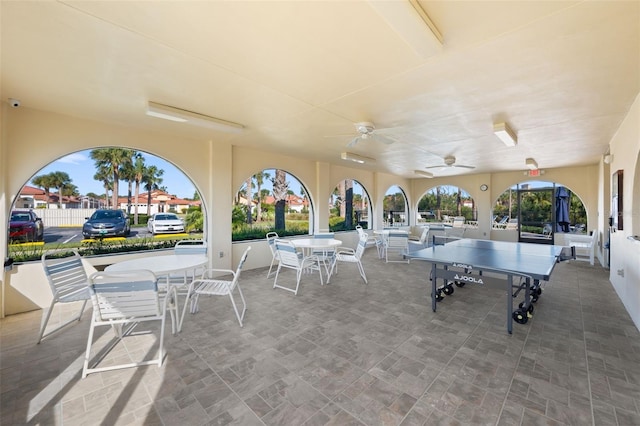 view of patio / terrace with a ceiling fan and outdoor dining space