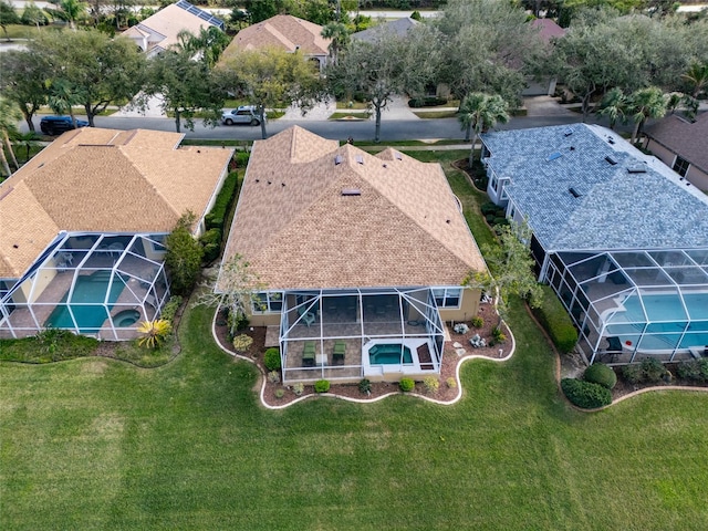 birds eye view of property with a residential view